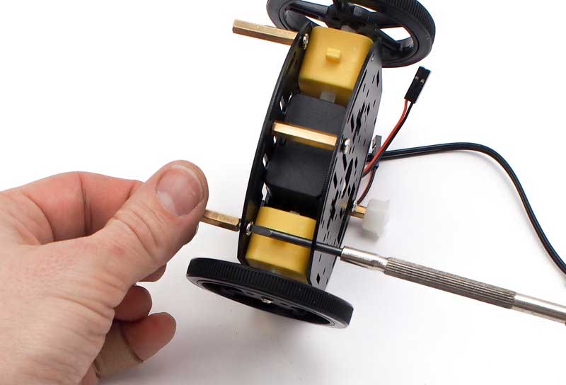 Screw in the Two Brass Standoffs